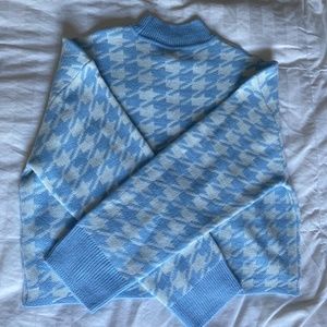 blue and white turtleneck sweater